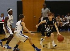 Will Pitts dribbles away from trouble for the Greer Middle School boys basketball team. Greer is unbeaten at 13-0 with two regular season games remaining.