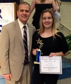 Anna McCleer, with Riverside Middle School Principal Eric Williams, won the Vocal performance at the school’s Talent Show Tuesday night.