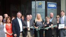 Kristi Farmer, Greer Branch Manager for the Guild Mortgate Company, cuts the ribbon celebrating the company's downtown location.
 
 