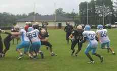 Greer's offensive line opened gaping holes like this one for the Yellow Jackets runners.