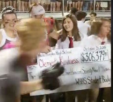 Wade Hampton High School students celebrate raising more than $306,000 during Spirit Week.
 