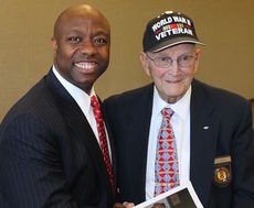 Sen. Tim Scott posed for a picture with World War II veteran Cliff Harpst when Scott visited Greer last year to introduce a veterans job program.
 
 