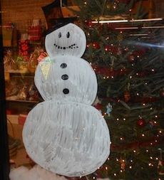 ACME General Store features Frosty the Snowman in its window showcase for the holidays.
