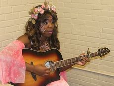 Antoinette Hall took advantage of a break during rehearsals to play acoustic guitar. She plays 