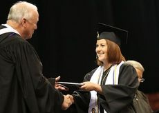 Bailey Knapp is all smiles after receiving her diploma at the Greer High School graduation at the Bon Secours Wellness Center on Wednesday night.
 