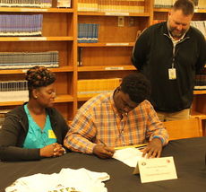 Tyreek Donaldson, offensive lineman with Greer High School, signed with Fairmont College Tuesday. Tonya Johnson, Donald's mother, and Head Coach Will Young attended.
 
 