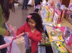 Bikes were distributed to some children and large bags were available for all children to fill during the Cops for Tots shopping spree Saturday.