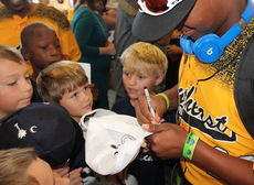 Terrence Gist, ESPN's poster player for longest home run during the Little League World Series, was smothered for autographs.
 