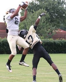 Emmanuel Kelly hauls in a pass from Dorian Lindsay while still in th air at Thursday's Greer versus Gaffney scrimmage at Dooley Field.