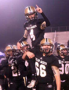 Nick Roberson kicked his 200th point after touchdown against Southside. The senior kicker is hoisted on the shoulders of his teammates with a game-winning kick against Westwood in a playoff game.
 