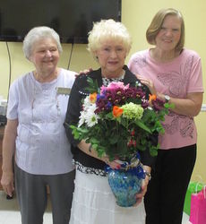Flowers for Shirley Holliday, the leading lady of music at Greer Community Ministries. Presented by Patsy Quarles, left and Charlene Patterson.
 
 
