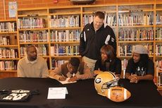 Quez Nesbitt signed a football grant-in-aid with Georgia Military College Thursday. Left to right: Jay Nesbitt (uncle), Jakeicha Nesbitt (aunt), Quez, and James Woodruff (uncle) attended the signing.
