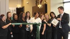 Greer Family Dental Care almost maneuvered the entire staff in on the ribbon cutting Wednesday. Dr. Sonya Shyam is in the white top, fifth from the left, and Dr. JaVona Brown is second from the right.