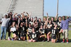 The seniors celebrate their 18-6 win in the annual Greer High School powder puff football game at Dooley Field.  Coaches were seniors from last season’s champion 3A Region III football team.