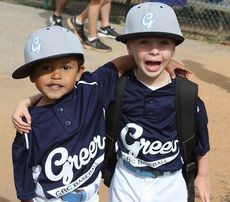 Hudson and Preston, best buddies, get photographed for a lifetime memory during opening day at Century Park  Field Saturday. The Parks and Recreation Department held its opening ceremonies Saturday.
 