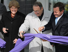 Cutting the ceremonial ribbon to the St. Francis Cancer Center are, left to right, Camilla Hertwig, Board Chair of the Bon Secours St. Francis Health System, The Most Rev. Robert Guglielmone, Bishop of the Diocese of Charleston, and Mark Nantz, CEO.
 