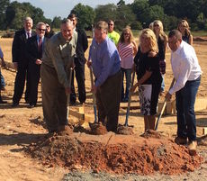 Keith and Kelly Herringshaw held a groundbreaking for their Concrete Connection business Thursday.
 