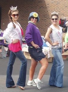 Sydney Sill and Lauren Cabaniss coached Lynn Dew in a pageant pose during activities at Praise Cathedral’s Relay for Life yard sale. Dew is the captain for Team Praise.
