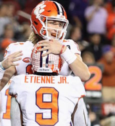 Trevor Lawrence and Travis Etienne Jr. celebrate a touchdown in Clemson's dominating win over Alabama for the national championship Monday.
 