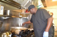 Chef Damion Norton prepares his meals for his competition versus Henry's Smokehouse.
 