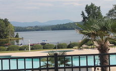 The picturesque view over the pool, across the lake and at the Blue Ridge Mountains greets visitors to Stillwaters of Lake Robinson.
 