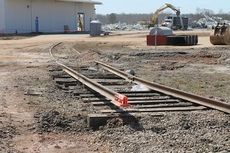 The rail spur in front of a South Carolina Port Authority warehouse is being removed since it's no longer needed. The warehouse, background, has been demolished.