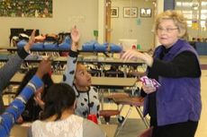 Elaine Romano, a math teacher at Greer High School, challenged the children with flash cards during the math bingo game. 
 