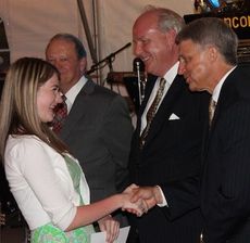 Mary Moore Driggers, winner of a $1,000 scholarship for her winning essay, is congratulated by CPW Commissioners, left to right, Eugene Gibson, Perry Williams and Jeff Howell.