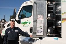 Darrell Hice of Swift Transportation shows the cylinders that hold compressed natural gas.
 
 
 