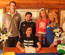 Kelsi Davis of Greer High School signs her letter of intent with the Spartanburg Methodist College women’s soccer team. Back row left to right: Carolina Football Club Executive Director Rafe Mauran, Carolina FC coach Ron DePaol, sister, Brylee Sims, and her mother, Brandi Sims.
 