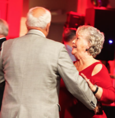 Nancy and her husband, Bob Harrison, dance during one of her many appearances for non-profits.
 