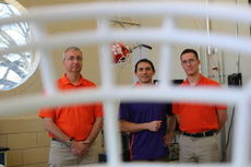 Clemson researchers (from left) John Desjardins, Gregory Batt and Alex Bina are working with Jay Elmore of Green Gridiron to create a safer facemask for football helmets.
 