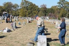 Stephen Paul Field, Sr., committee chairman for Boy Scouts Troop 107, and his wife, Rachel, search for veterans gravesites at Mountain View Cemetery.
• On the home page: Nickolas Charles locates a veteran's gravesite.
 
 