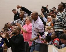 Greer fans cheer their team as the end is near in the championship victory over Bryson Saturday.