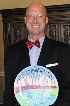 Jason Clark displays a plate that symbolizes landmarks in the Upstate. Clark was honored for the best of the best Restaurateur of the Year for his fine dining restaurant BIN112.
 
 
