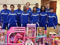 The Riverside High School basketball team took children shopping for their Christmas presents at the Cannon Centre.