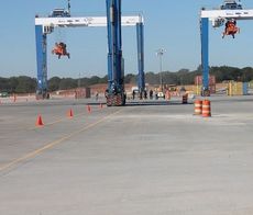 Gov. Nikki Haley and port officials are dwarfed by the enormity of the 45-acre facility, cranes and equipment. 
