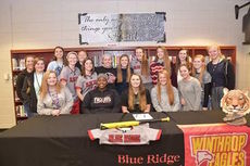 The Blue Ridge High School softball team surround their teammate, Ansley Gilreath, for a memorable birthday and college signing photo.
 