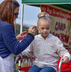 Face painting is popular at any festival.
 