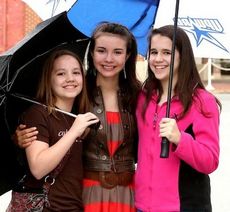 Sophia Noyes, center, with her friends Caroline Lynch, left, and Cathrine Lynch, during Saturday's Greer Idol auditions at the Greer Family Fest. Noyes was awarded a gold card to advance to the May 31 callbacks. She sang 