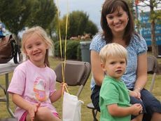 There were plenty of activities for children with inflatables, giveaways and games. Diane Sullivan brought her two children, Nora, left, and Owen.