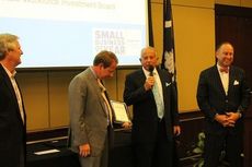 Mayor Rick Danner presents Smith & James the Mayor's Award for small business to Brandon and Bernard Price and Chip Bittner.
 