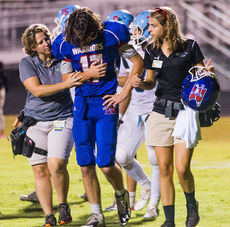 Riverside loses the first of two quarterbacks with injuries when Anthony Brown is helped off the field.
 