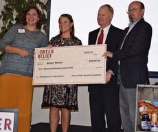 Rick Medlock, President/CEO of Greer State Bank, second from right, and April Staggs, second from left, vice president of Commercial Lenders, presented its donation from the bank's Foundation.
 