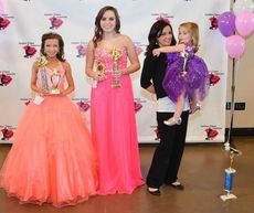 Mary Alice Boone (orange dress) and Lauren Lynn (pink dress) tied as winners of the talent division for the Southern Dance Connection Relay team. Boone won most photogenic. Adalyn Lovelace won the Tiny Miss division and Community Sponsor Award.
 
 
XXX