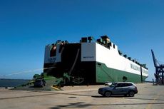 A BMW X3 and X5, assembled at Greer's BMW Manufacturing Co., are loaded onto a ship at the Port of Charleston.