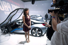 The BMW i8 Concept, featured in next month’s “Mission Impossible: Ghost Protocol” is a low-slung, silver and glass sports car with flip-up doors.  