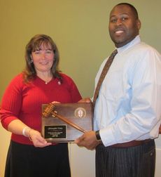 Christopher Utsey is recognized as outgoing North Greenville University Alumni Association President. Camilla Pitman, President of the Executive Committee, makes the presentation.