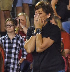 Tonya Christ reacts to her daughter, Chase, being named Blue Ridge High School Homecoming Queen. Christ Christ is Chase's father, who escorted her at the halftime ceremonies.