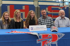 Emma Harms signed with Newberry while family members watched, left to right, sister, Molly, mother, Becky, father, Scott, and grandfather, Robert Harms.
 